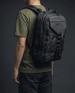 Vanta 22 EPX backpack lifestyle — walking urban commute with recycled sailcloth bag