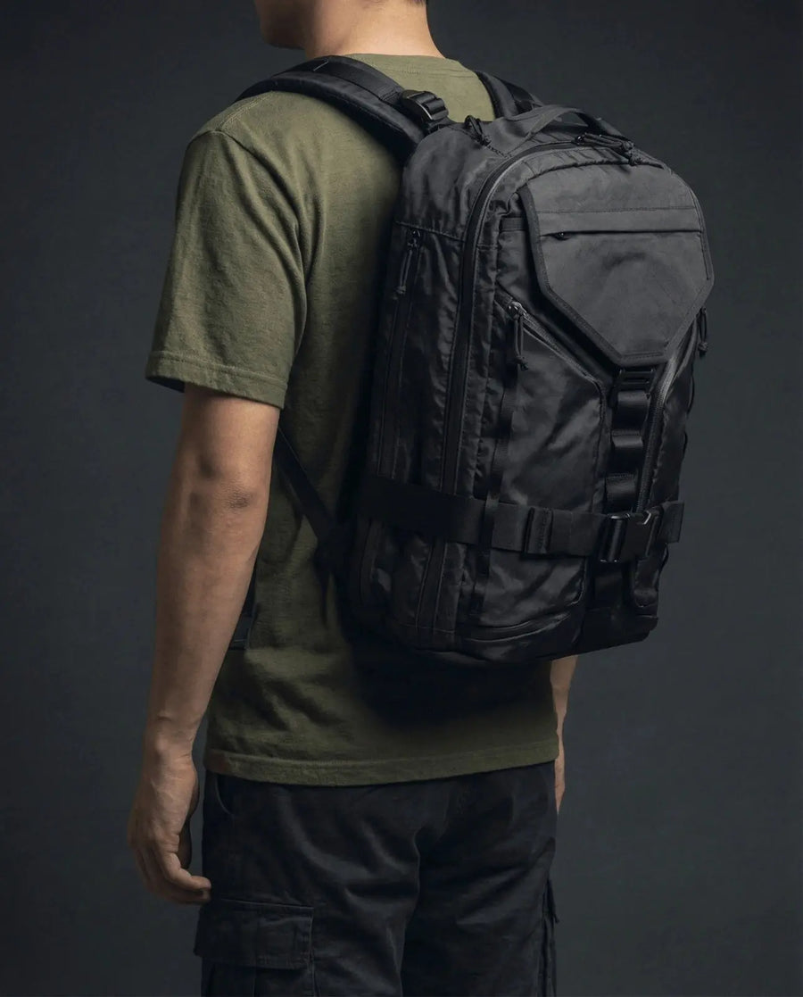 Vanta 22 EPX backpack lifestyle — walking urban commute with recycled sailcloth bag